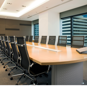 Empty board room table and chairs
