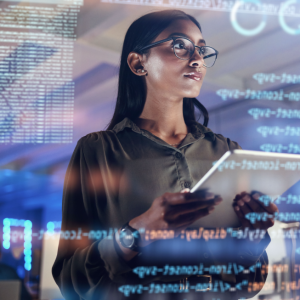 Woman analyzing data on large screen